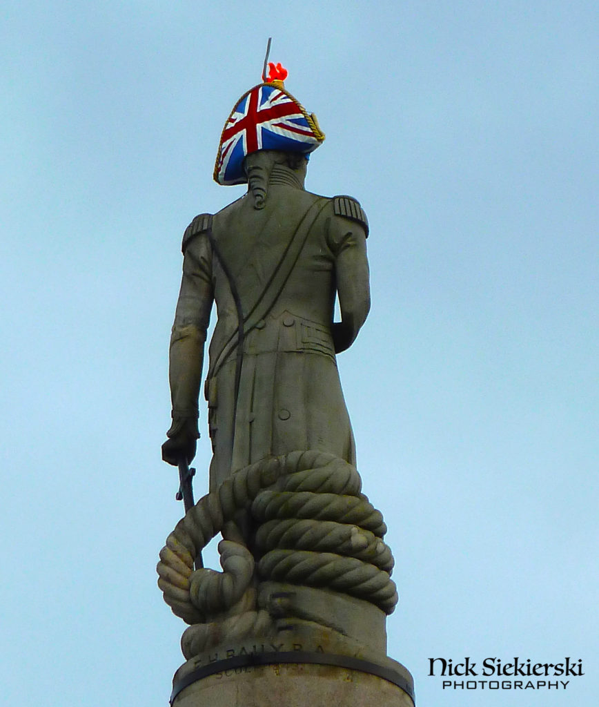 Admiral Horatio Nelson statue on Trafalgar Square, London with Union Jack on back of his hat