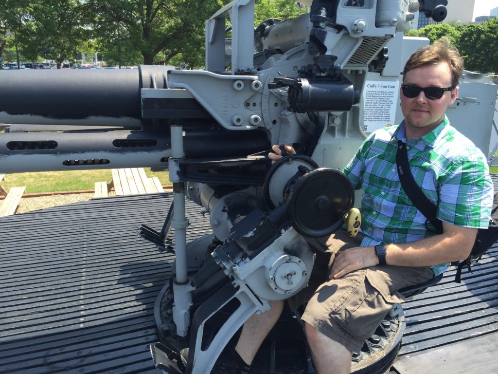 Sitting at the USS Cod's 7-inch gun